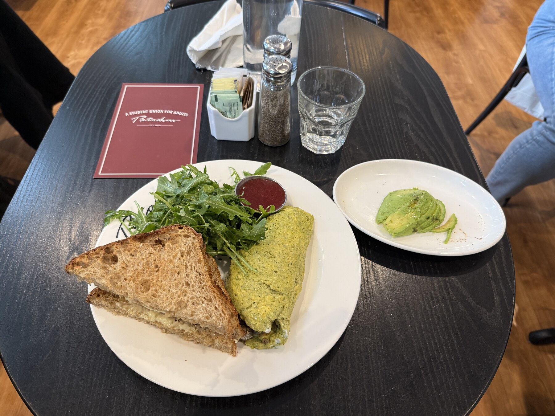 Green omelet, sourdough toast, salad and avocado at Patachou